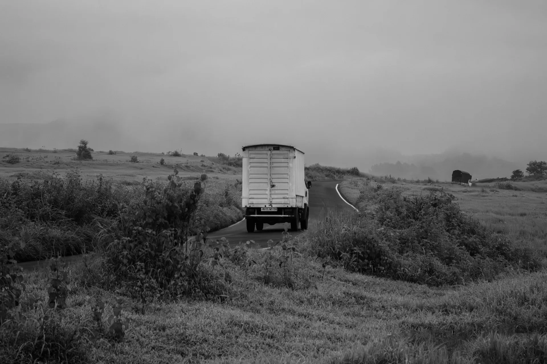 Moving truck on the road at dusk
